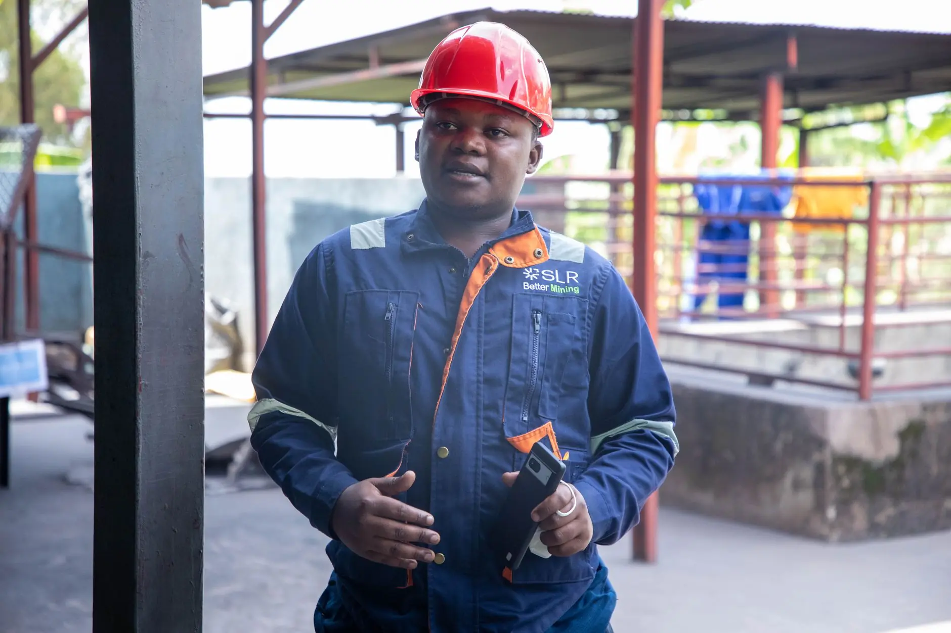 Nigerian engineer in a hard hat at a project site
