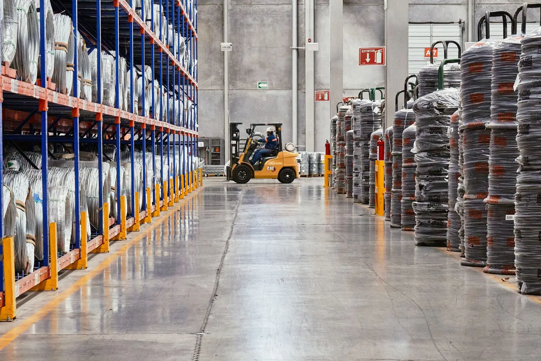 Warehouse racking with a forklift moving stock